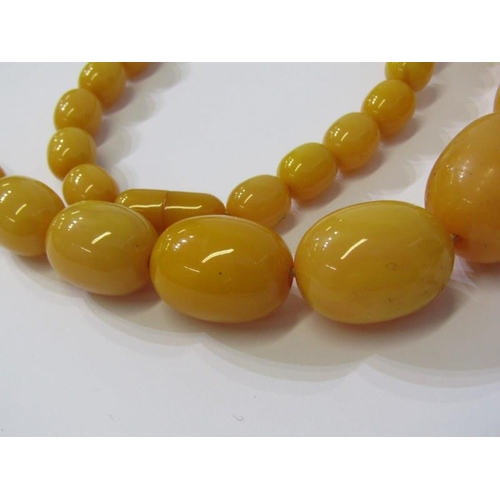 94 - SET OF GRADUATED FAUX AMBER BEADS