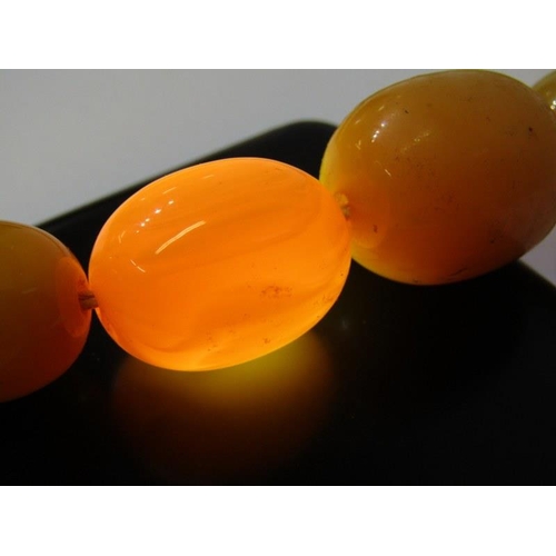 94 - SET OF GRADUATED FAUX AMBER BEADS