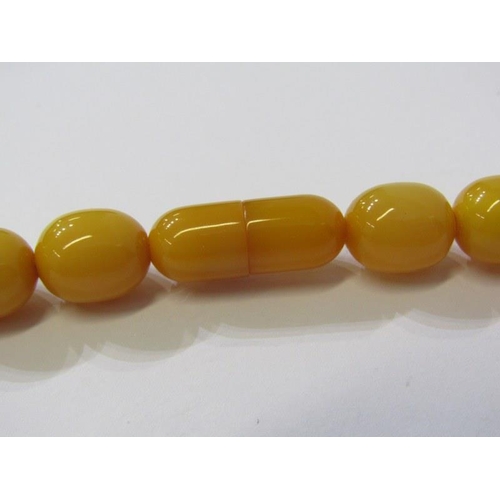 94 - SET OF GRADUATED FAUX AMBER BEADS