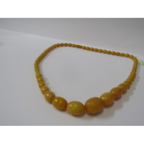 94 - SET OF GRADUATED FAUX AMBER BEADS