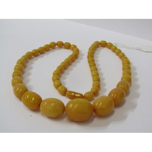 94 - SET OF GRADUATED FAUX AMBER BEADS