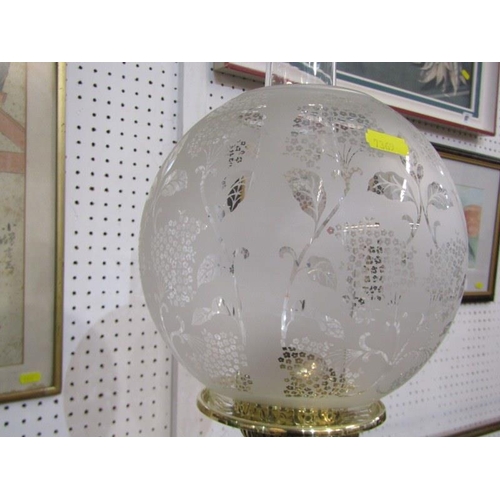 106 - VICTORIAN OIL LAMP, an attractive embossed brass circular based oil lamp with frosted glass shade