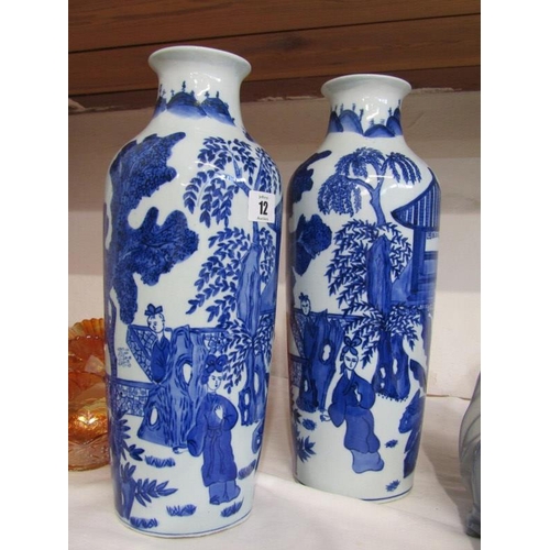 12 - ORIENTAL CERAMICS, a pair of modern oriental porcelain vases painted with ladies in a garden setting... 