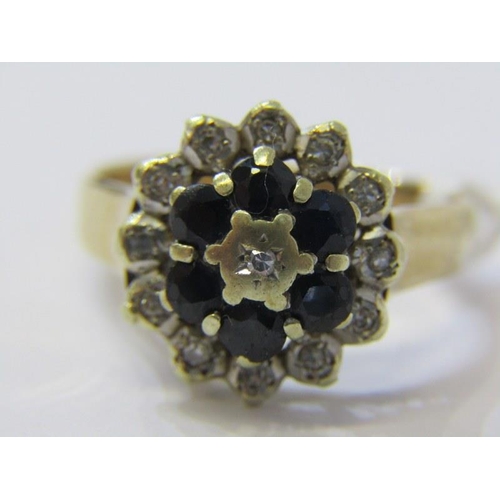 219 - SAPPHIRE & DIAMOND CLUSTER RING, 9ct Yellow gold ring set a central diamond surrounded by a band of ... 