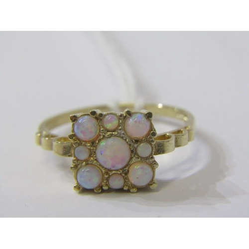 141 - OPAL RING, 9ct yellow gold ring set a cluster of 9 opals in a plaque style setting, size Q