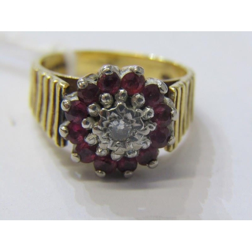 173 - DIAMOND & RUBY CLUSTER RING, heavy 9ct yellow gold ring, set a central diamond, surrounded by a clus... 