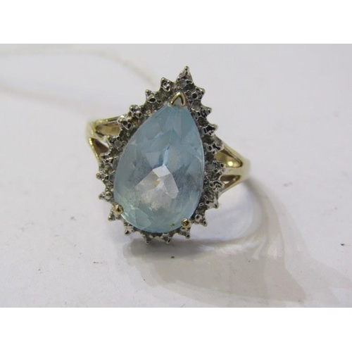 206 - AQUAMARINE & DIAMOND RING, 9ct yellow gold ring set a pear shaped aquamarine, surrounded by a cluste... 