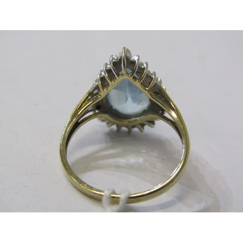 206 - AQUAMARINE & DIAMOND RING, 9ct yellow gold ring set a pear shaped aquamarine, surrounded by a cluste... 