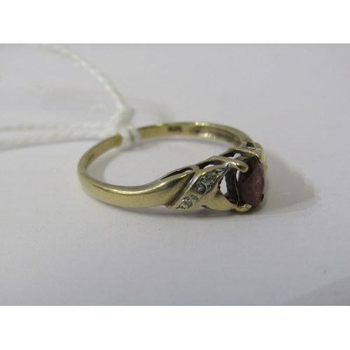 217 - GARNET & DIAMOND RING, 9ct yellow gold ring set a central oval garnet with diamond shoulders, size Q