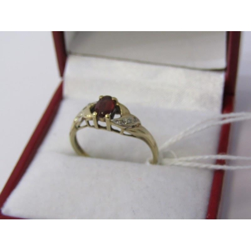 217 - GARNET & DIAMOND RING, 9ct yellow gold ring set a central oval garnet with diamond shoulders, size Q