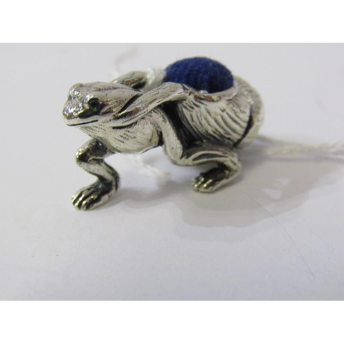 240 - NOVELTY SILVER PIN CUSHION, in the form of a frog with beaded eyes pulling a snail shell