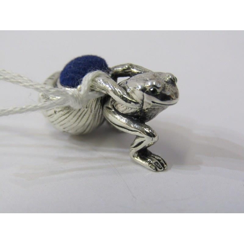 240 - NOVELTY SILVER PIN CUSHION, in the form of a frog with beaded eyes pulling a snail shell