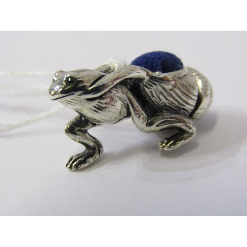 240 - NOVELTY SILVER PIN CUSHION, in the form of a frog with beaded eyes pulling a snail shell