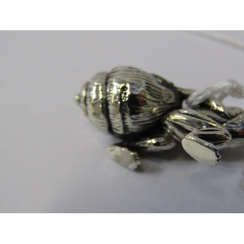 240 - NOVELTY SILVER PIN CUSHION, in the form of a frog with beaded eyes pulling a snail shell