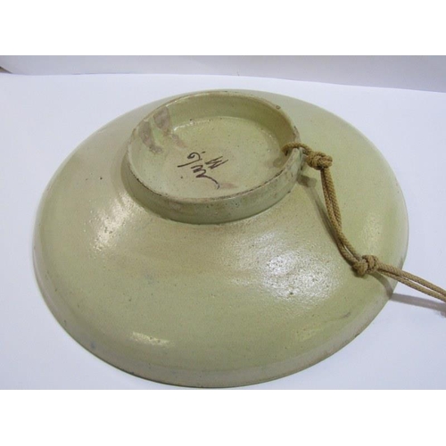 89 - ISLAMIC POTTERY, a shallow circular dish, 28cm diameter