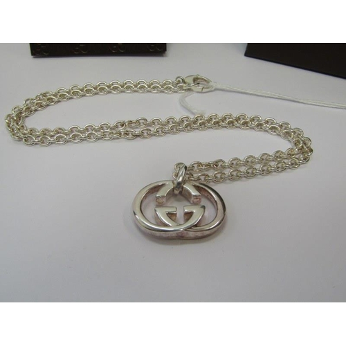 12 - GUCCI, HM silver Gucci pendant on chain, 18