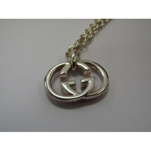 12 - GUCCI, HM silver Gucci pendant on chain, 18