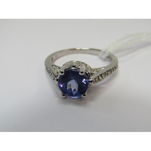 14 - TANZANITE & DIAMOND RING, 18ct white gold ring set a large oval tanzanite with 8mm spread, with diam... 