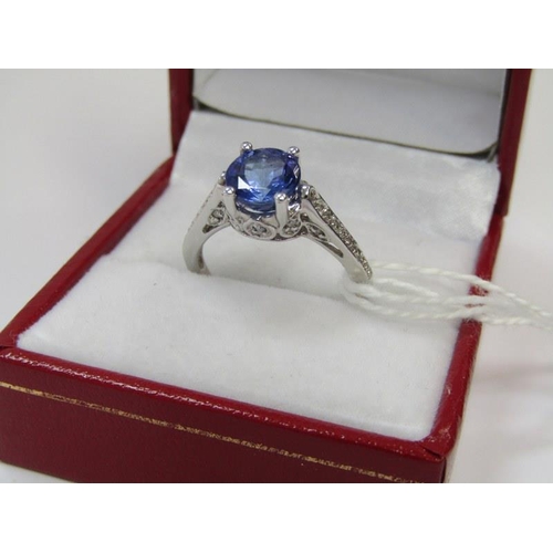 14 - TANZANITE & DIAMOND RING, 18ct white gold ring set a large oval tanzanite with 8mm spread, with diam... 