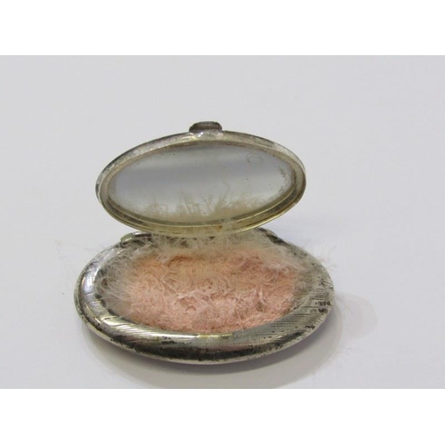 35 - 2 SIMILAR SILVER MINIATURE COMPACTS, of oval form, each with engine turned decoration, 4.5cm width, ... 