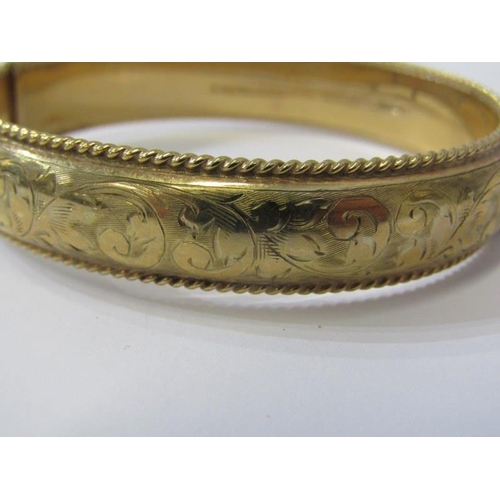 43 - GOLD BANGLE, 9ct yellow gold hinged bangle with foliate engraved decoration, 20.1 grams