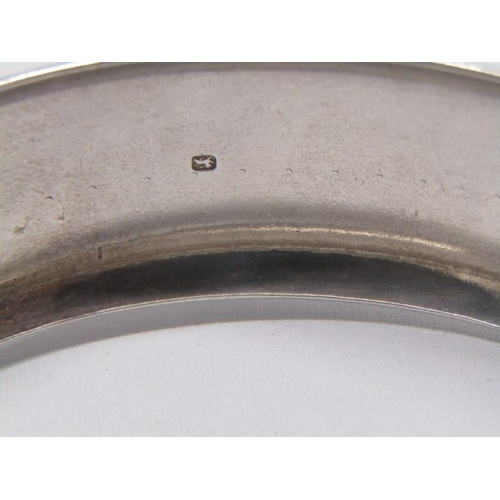 165 - HEAVY SILVER HINGED BANGLE, with foliate decoration, 42.5 grams