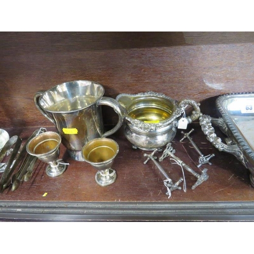 63 - SILVERPLATE, Victorian decanter stand, sugar tongs, wine funnel & contents of shelf