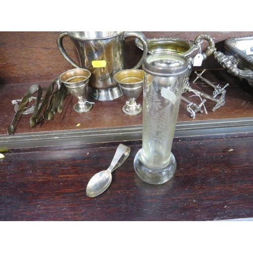 63 - SILVERPLATE, Victorian decanter stand, sugar tongs, wine funnel & contents of shelf