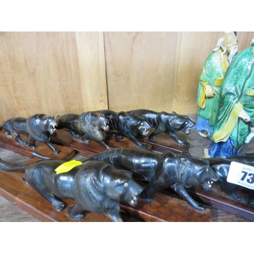 73 - ORIENTAL CERAMICS, collection of 10 pottery figures, together with 8 carved horn lions