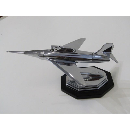 1 - ART DECO, a chromed jet plane table lighter with patent inset plaque on base, 23cm length