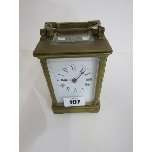 107 - CARRIAGE CLOCK, brass cased carriage clock with bevelled glass panels, 12cm height