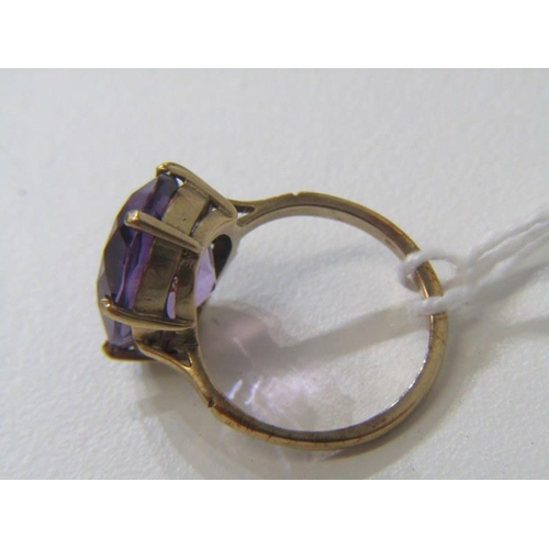 144 - AMETHYST RING, 9ct yellow gold ring set with large oval cushion cut amethyst, approx 15mm spread, si... 