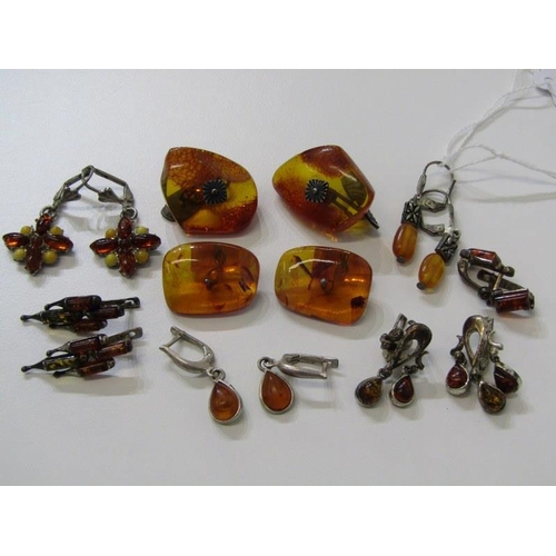 175 - AMBER JEWELLERY, 7 pairs of assorted silver and amber earrings, together with a pair of amber cuff l... 