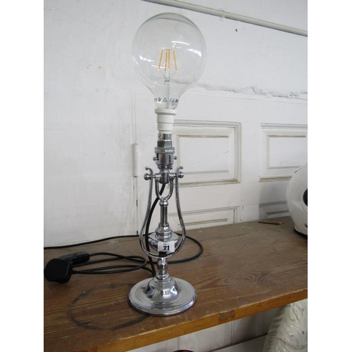 21 - VINTAGE LIGHTING, a chromed gimballed table lamp