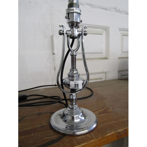 21 - VINTAGE LIGHTING, a chromed gimballed table lamp