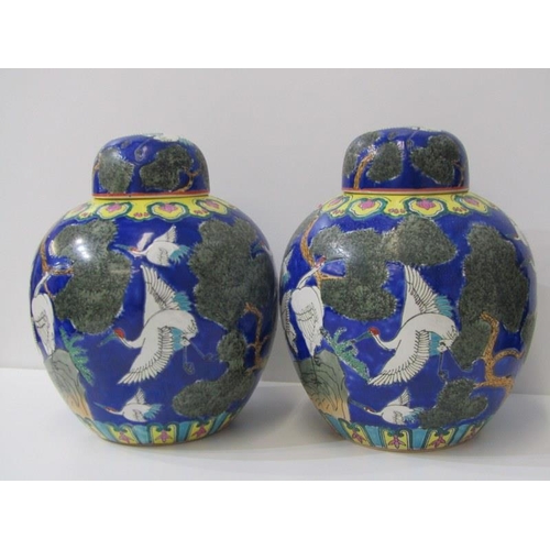 43 - ORIENTAL CERAMICS, pair of modern lidded ginger jars decorated with cranes 28cm height