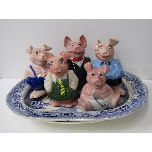 49 - WADE, family of Wade Nat West piggy banks together with 2 vintage Willow pattern meat plates