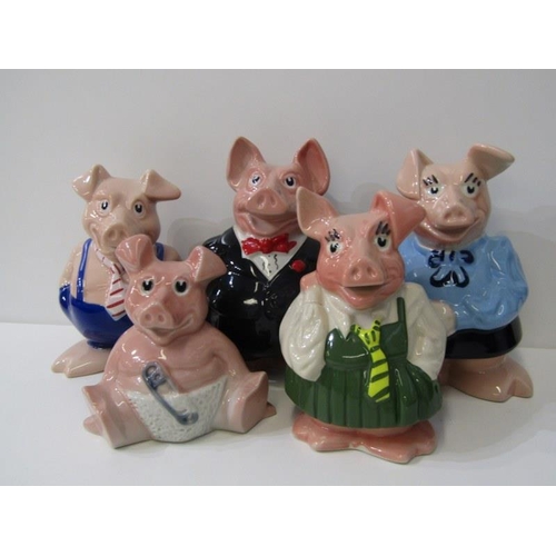 49 - WADE, family of Wade Nat West piggy banks together with 2 vintage Willow pattern meat plates