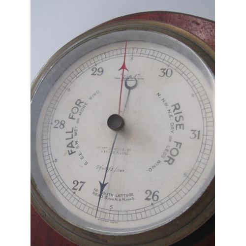 64 - ANEROID BAROMETER, a maritime design brass case wall barometer, 17cm face diameter