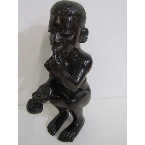 93 - ETHNIC CARVINGS, collection of West African carved hardwood figures, including a drum player, acquir... 