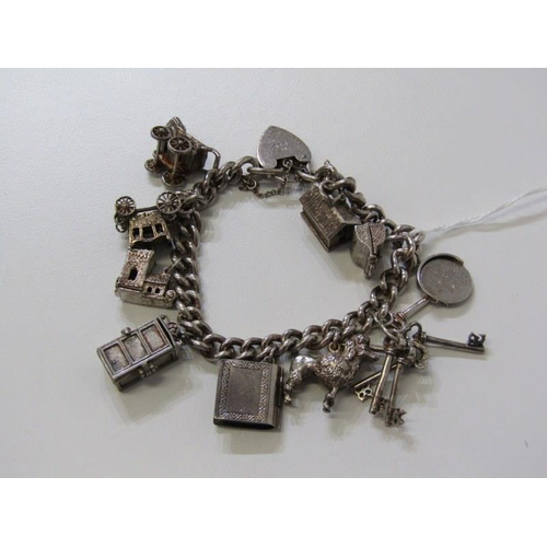 402 - SILVER CHARM BRACELET, curb link bracelet with padlock clasp with approximately 10 charms, 64.5grms