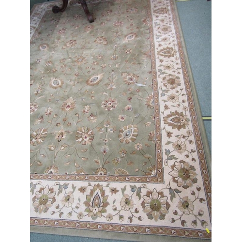 989 - CHINESE DESIGN CARPET, A floral decorated carpet on a green ground within 3 main borders, 3.4 m x 2.... 