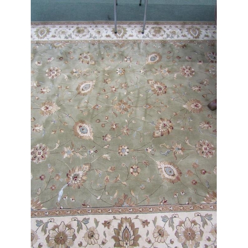 989 - CHINESE DESIGN CARPET, A floral decorated carpet on a green ground within 3 main borders, 3.4 m x 2.... 