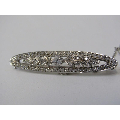 562 - 9ct GOLD DIAMOND SET BAR BROOCH, approximately 4.8 grams in weight