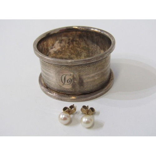 563 - SILVER NAPKIN RING, together with a pair of 9ct gold pearl stud earrings