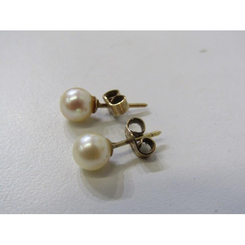 563 - SILVER NAPKIN RING, together with a pair of 9ct gold pearl stud earrings