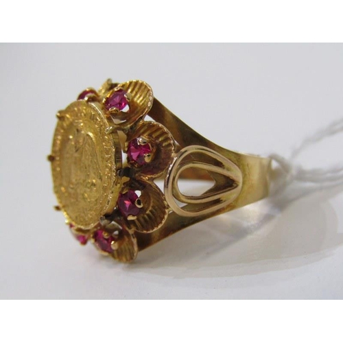 19 - COIN STYLE RING, 9ct yellow gold ring, set a coin style plaque with rubies to the outer, size K. 6.7... 