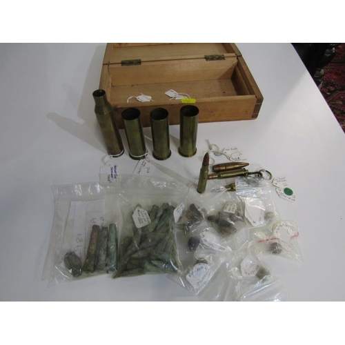 403 - MILITARIA INTEREST, small collection of brass shell cases, also spent bullets recovered from Cold Be... 