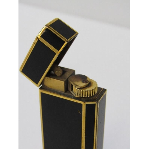 44 - CARTIER, Cartier black and gilt cigarette lighter