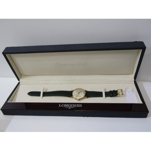 54 - LONGINES, a Gent's Longines gold cased wrist watch on green leather strap with presentation inscript... 